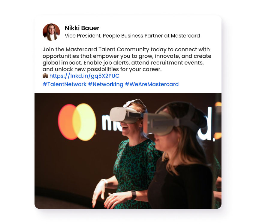 Two people wearing VR headsets at a Mastercard event or innovation space